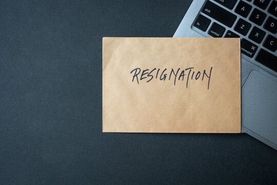 Resignation letter on top of computer keyboard. Quit job concept.