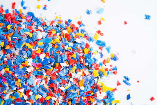 Plastic colorful pieces recycling shredded for industrial use.