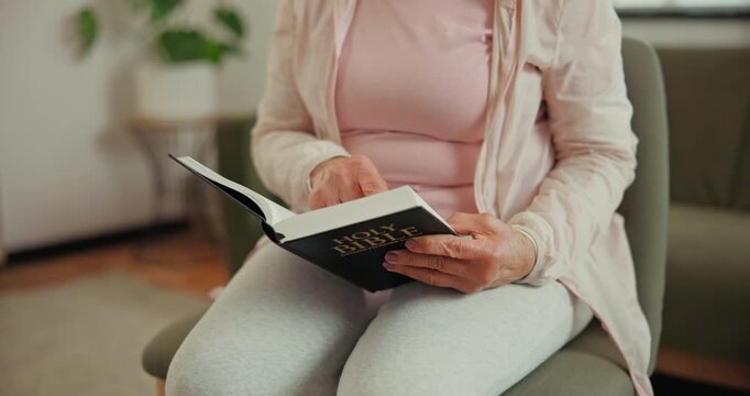 Hands, bible and old woman reading in house with Christian belief, knowledge or worship Jesus Christ. Senior person, holy book or faith in retirement with Catholic religion, spiritual guide or gospel