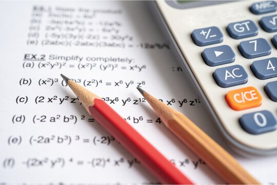 Mathematics homework featuring algebraic equations, two wooden pencils, and a calculator, illustrating problem-solving, numerical calculations, and academic study.