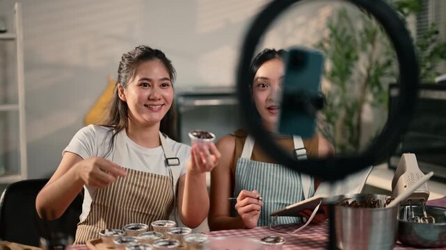 Asian women vlogging baking class live streaming