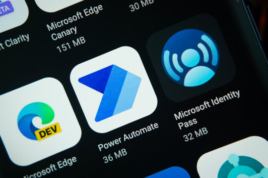 Redmond, United States - 15 Oct 2026: Microsoft Edge, Power Automate and Microsoft Identity Pass app icons are seen on a smartphone screen.