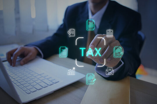 Male Executive Pointing at Digital Tax Documents Hologram with Stylus Pen