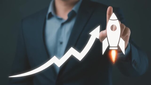 Businessman's hand launching rocket on upward financial graph during dark studio lighting signifying business growth and success