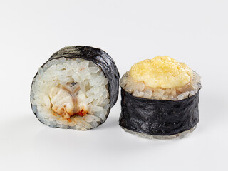 Asian bistro maki sushi rolls with white rice, dark seaweed wrap and creamy yellow topping, Japanese seafood snack © Andrei Starostin
