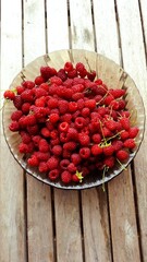 Fresh ripe raspberries served on a plate © Iryna