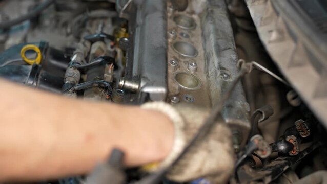 Close-up view of weathered automotive engine block with attached components