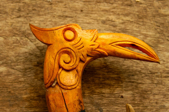 Traditional Dayak Mandau Handle with Intricate Hornbill Bird Carving from Borneo, Indonesia