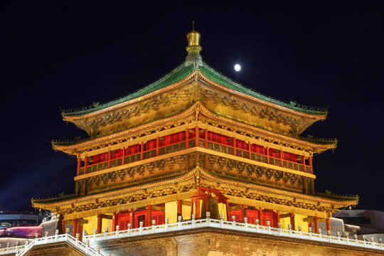 The moon rises above the Bell Tower of Xi'an, an iconic Ming Dynasty building in Xi'an, China
