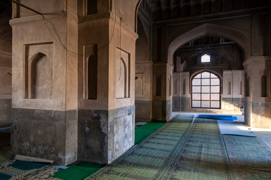 Massive stone pillars and arches inside the prayer hall of Pathar mosque, Jammu and Kashmir, Srinagar, India