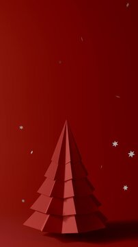 Red paper Christmas tree with falling snowflakes loop vertical video