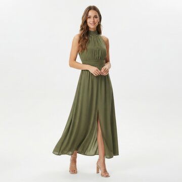 Beautiful young woman wearing a stylish green sleeveless maxi dress standing and posing isolated on white background