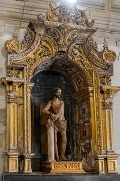 a polychromed wooden sculpture of Christ bound to the pillar,