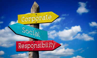 Corporate, social, responsibility - colorful wooden signpost with three arrows, sky with clouds © PX Media
