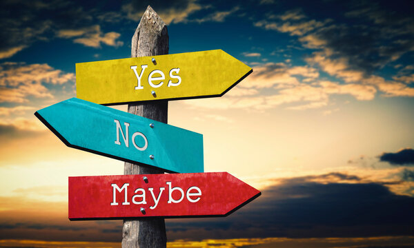 Yes, no, maybe - colorful wooden signpost with three arrows, sunset sky