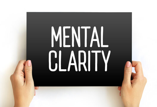 MENTAL CLARITY text held by hands. Calm and focused psychological concept for stress relief, mindfulness, and cognitive health. Clean visual for wellness topics.