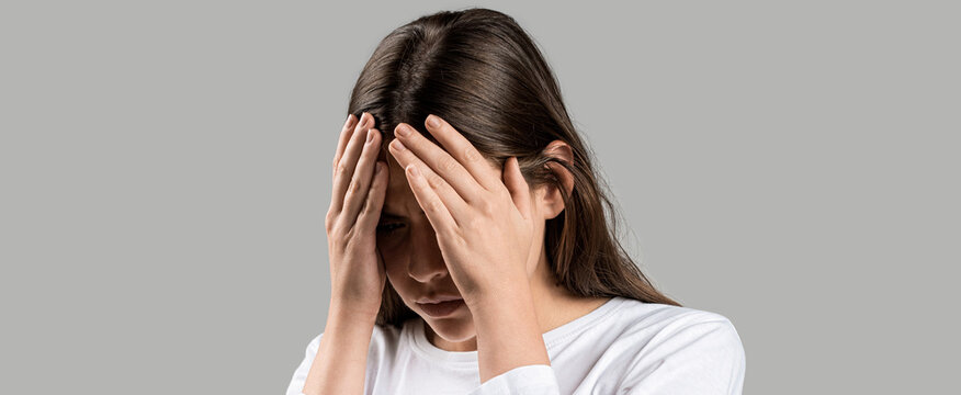Woman suffering from headache desperate, stressed because pain and migraine. Girl suffering from headache. Cold symptoms