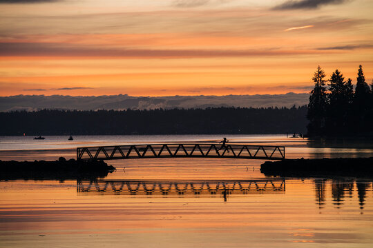 Pacific Islander runner crossing bridge