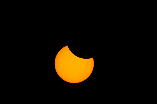 Partial solar eclipse over the sun