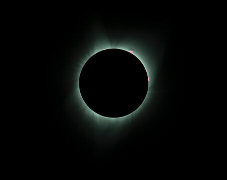 Solar eclipse displaying the sun's corona beyond the moon