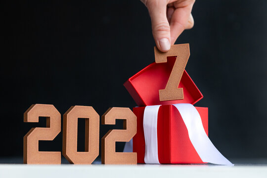  Hand Lifting Wooden 7 from Gift Box, Welcome 2027 New Year Concept