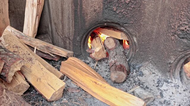 Traditional mezcal oven fire for cooking agave