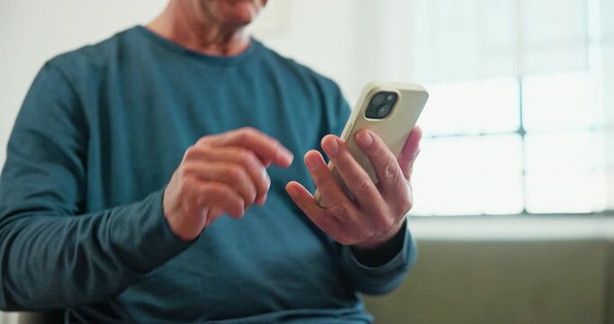 Hands, scroll and old man in retirement home with phone, check digital news and social media app. Senior person, online and browsing in living room with tech, text message and website for article.