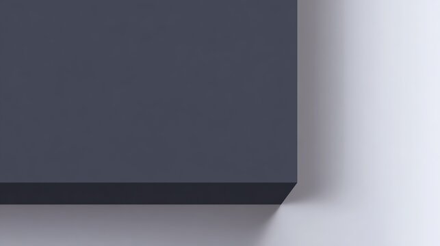 Dark gray box and white wall with sharp corner and shadows