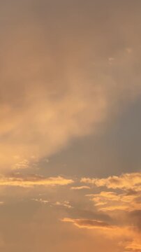 Nature background of sunset with beautiful yellow clouds on the sky