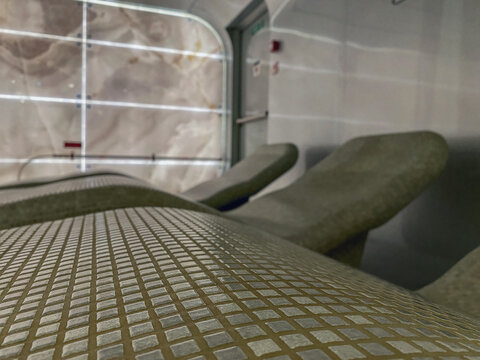 Thermal suite relaxation room loungers or chairs in spa or wellness area on modern luxury cruiseship or cruise ship ocean liner in clean modern design