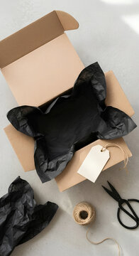 Eco friendly gift packaging with black reusable bag and twine for