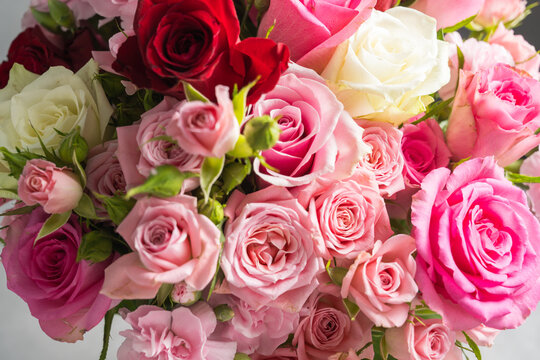 Close up of pink roses and carnations in a romantic floral bouquet