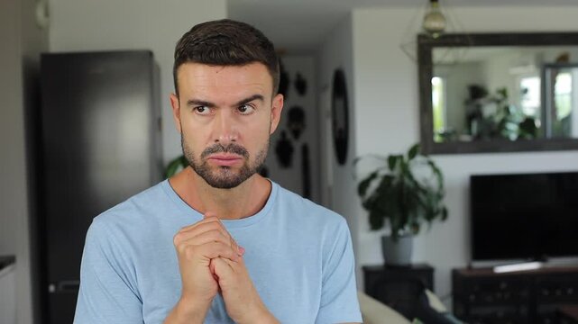 Serious man cracking knuckles with anger