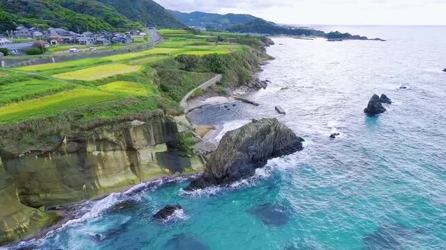 Aerial shot flying over the Byobuiwa sea stack in Kyoto, Japan⁠