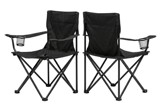 Two black folding camping chairs facing away isolated on transparent background