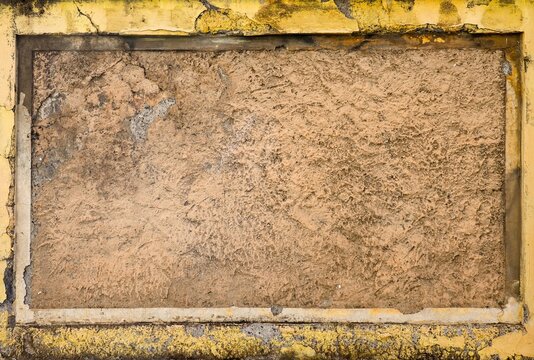 Old textured wall creating abstract framed background