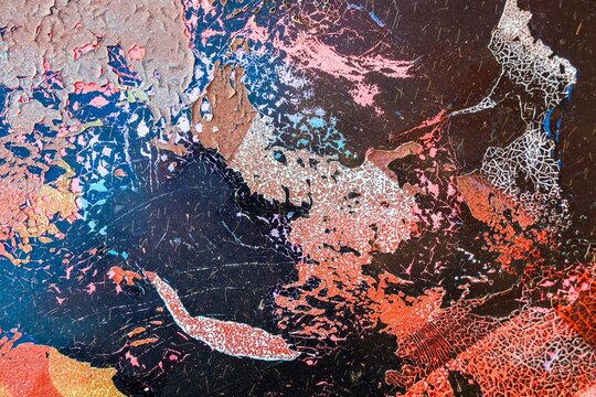 Peeling paint creating abstract texture on grunge surface