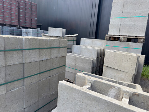Stacks of concrete blocks and building materials at a construction