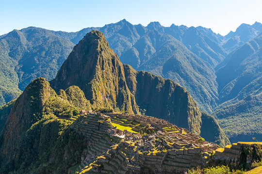 Machu Picchu and Andes mountain peaks at sunrise, Cusco, Peru.