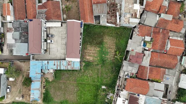 Aerial View of Dense Urban Houses and Mountain Landscape in West Java Indonesia
