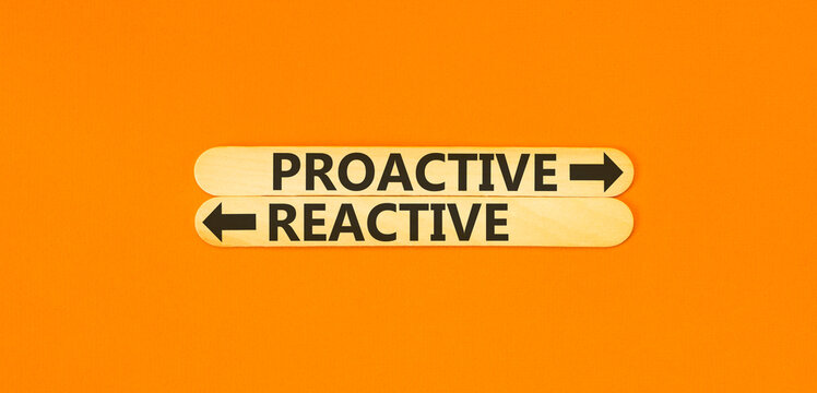 Proactive and reactive symbol. Concept word Proactive Reactive on beautiful wooden sticks. Beautiful orange background. Business proactive and reactive concept. Copy space.