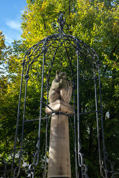 Berlin, Germany; 1st October 2026: Berlin Wappenbrunnen fountain with a stone bear and shield beneath an ornate iron canopy in Nikolaiviertel.