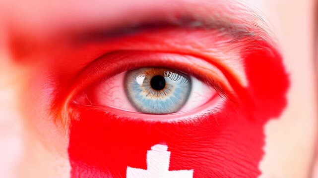 Extreme macro photorealistic footage of a fictional adult human male eye with Switzerland face paint and natural ice-blue iris

