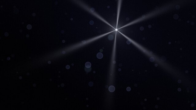 Bright six-ray star with silver beams and blue bokeh on dark navy