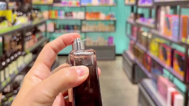 Perfume and Eau de Toilette Bottles on Display in Cosmetics Store &ndash; Fragrance Products on Shelf with Blurred Perfume Background