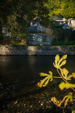 Traditional stone house by the Buna River, surrounded by trees in Blagaj, Bosnia and Herzegovina