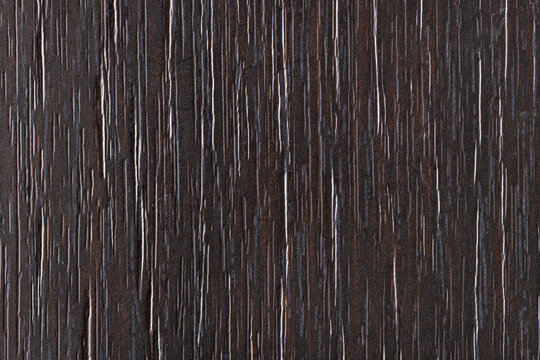 Dark brown wood grain texture background with vertical lines and natural pattern
