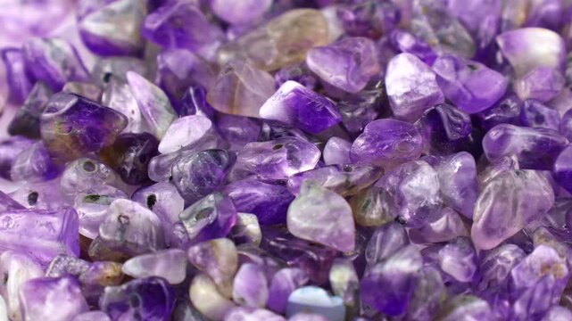Purple and violet amethyst stone crystals and gems circle rotation close up