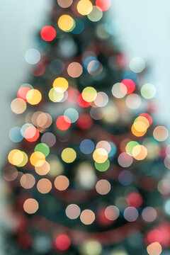 Full Frame Christmas Tree Silhouette with Warm and Cool Bokeh Lights