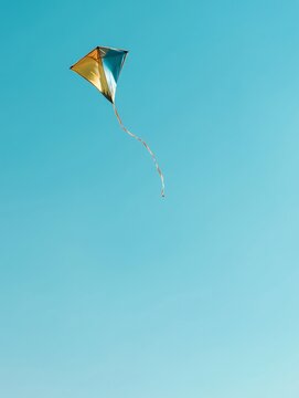 colorful kite flying in a clear blue sky